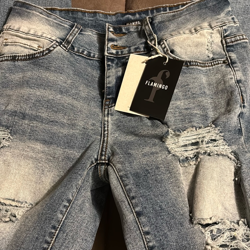 1 Brand New Pair Flaming Jeans
Distressed acid wash holes on front